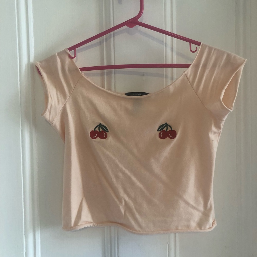 Fun crop top with cherry designs.